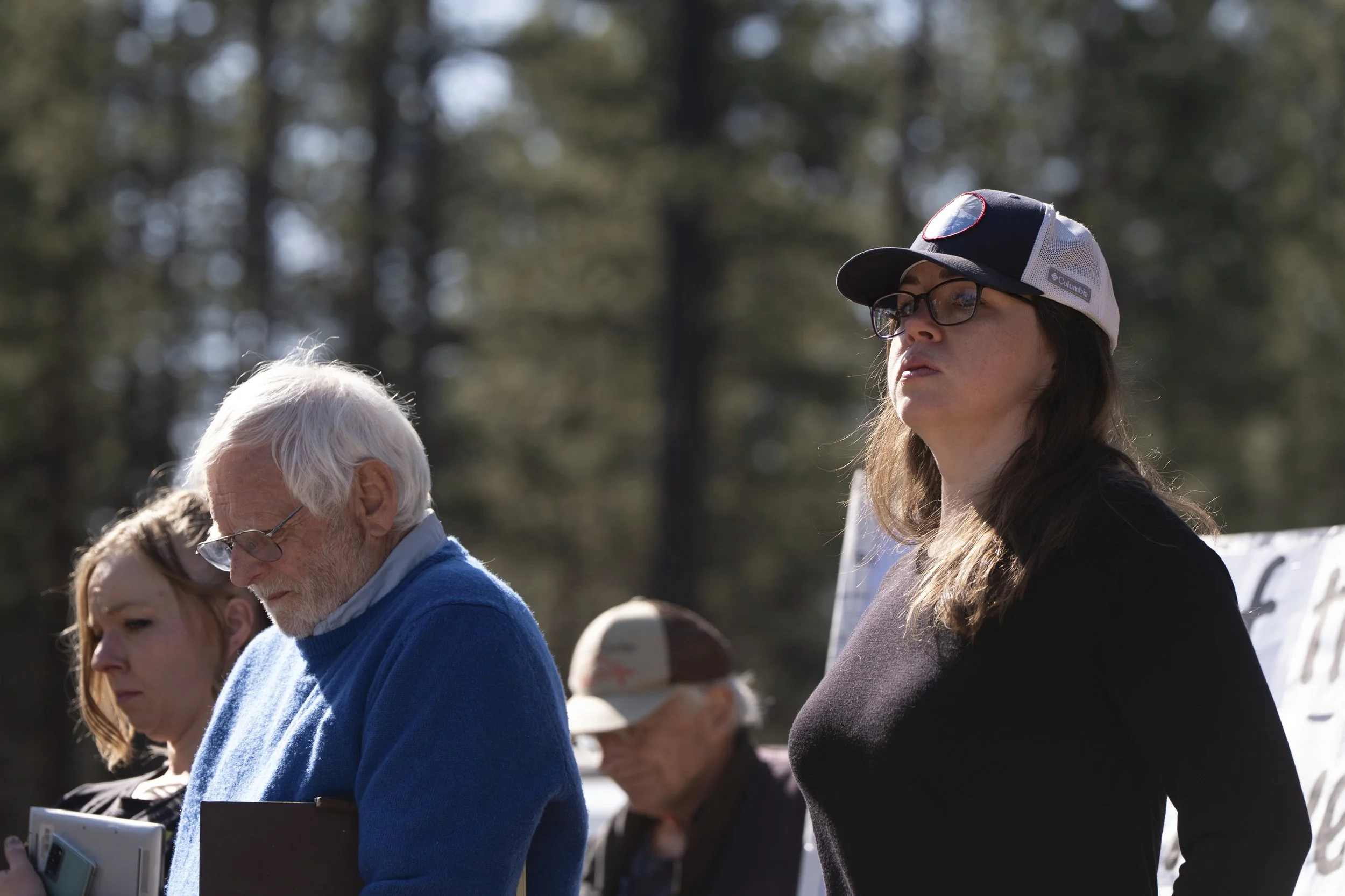 Jessica Gamble, who started the nonprofit Home More Network in 2022, right, looks on after reading text messages she received when a road to a homeless encampment in Deschutes National Forest was closed on Thursday, May 1, 2025, near Bend, Ore. 