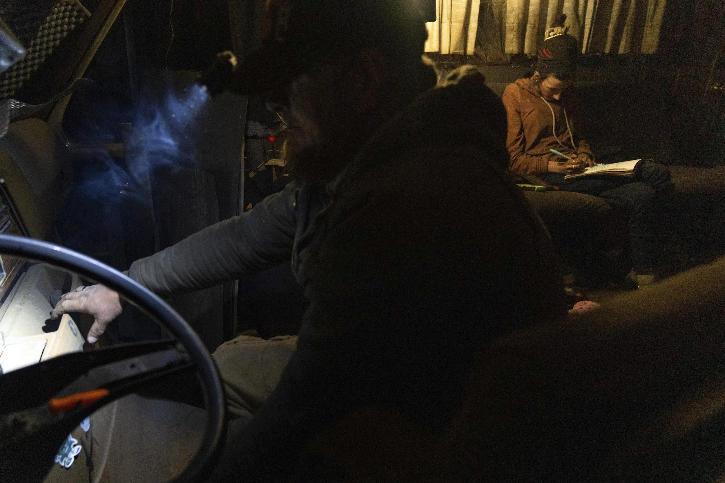 Chris Daggett works to get an RV to start so that it can be moved at a homeless encampment in Deschutes National Forest Wednesday, April 30, 2025 near Bend, Ore.