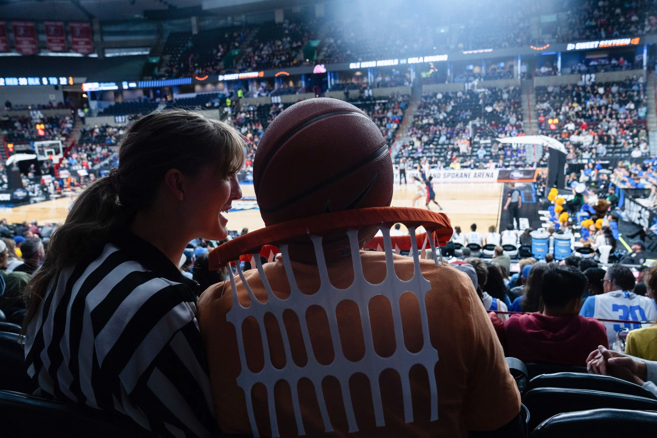 KC Gamo, left, and James Krahn, both from Canada, watch the second half in the Sweet 16 of the NCAA college basketball tournament between Mississippi and UCLA, Friday, March 28, 2025, in Spokane, Wash.
