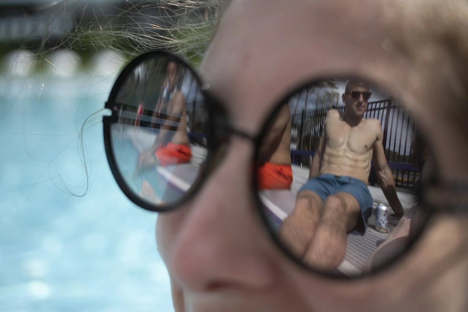 Lindsay Rothfeld talks with Yosef Herzog at a pool in Equinunk, Pa.