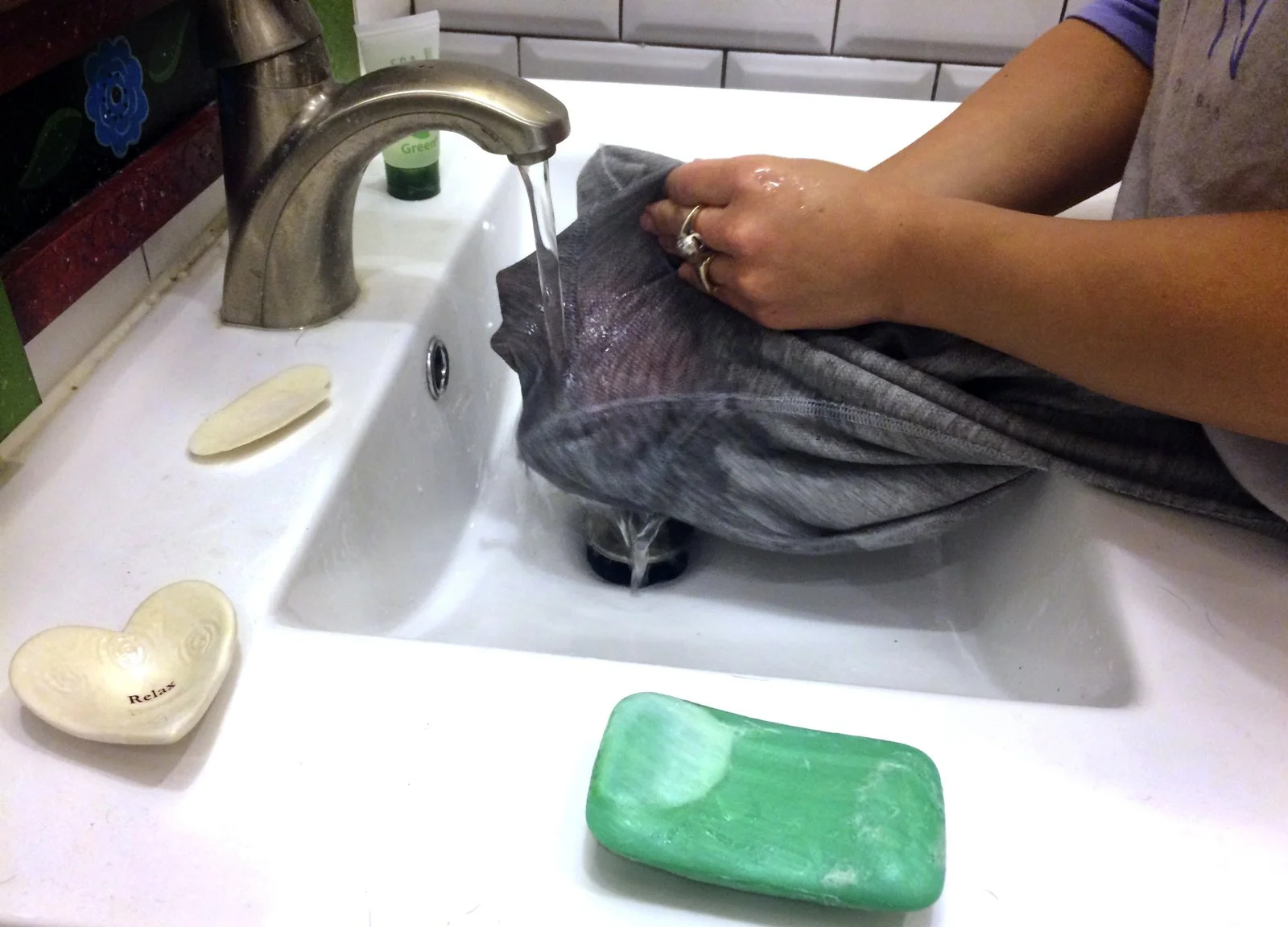 Jessica Cohen cleans a period stain out of her pajama pants in the Brooklyn borough of New York.