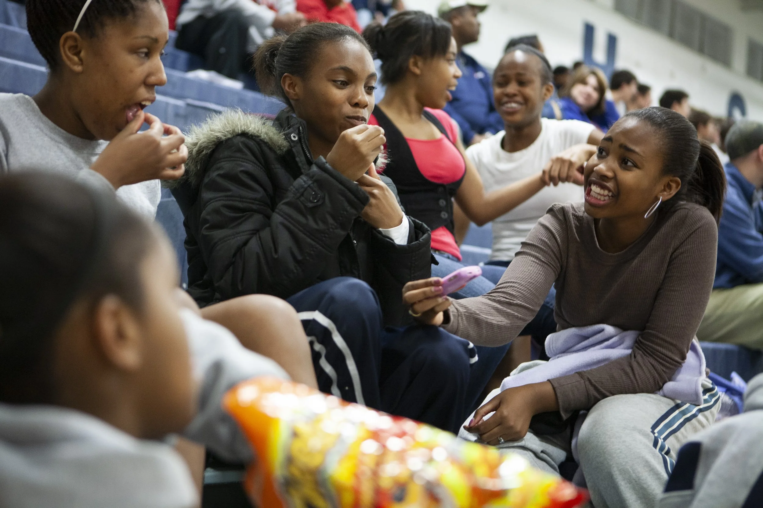 Members of the Greenwood high school junior varsity basketball team hang out after a scrimmage against Ballard High School in Bowling Green, Ky.