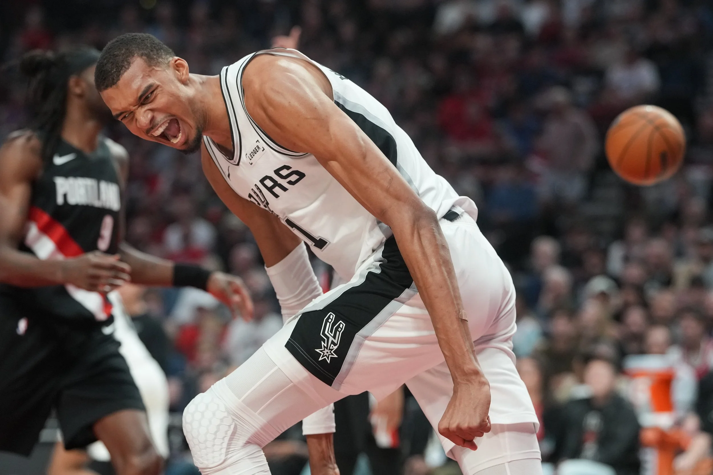 San Antonio Spurs center Victor Wembanyama reacts after a shot during the first half in Game 4 of a first-round NBA basketball playoffs series against the Portland Trail Blazers, in Portland, Ore., Sunday, April 26, 2026.