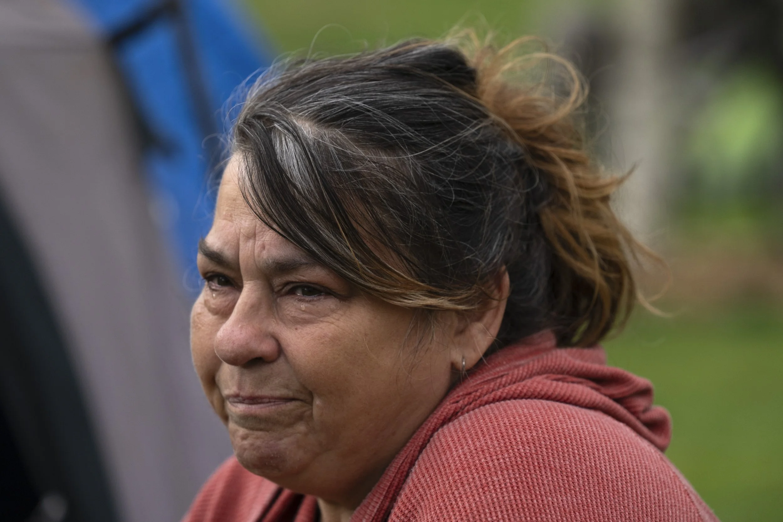 Laura Gutowski tears up while speaking to the Associated Press, Saturday, March 23, 2024, at Fruidale Park in Grants Pass, Ore. Gutowski’s life was upended when her husband died from a pulmonary embolism. Suddenly, in her 50s, she found herself with 
