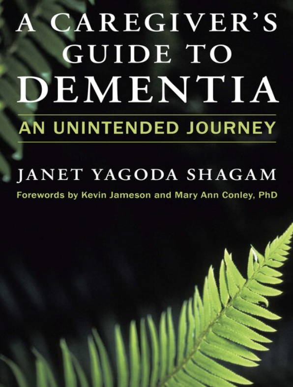 Book cover titled 'A Caregiver's Guide to Dementia: An Unintended Journey' by Janet Yagoda Shagam with forewords by Kevin Jameson and Mary Ann Conley, PhD. The cover features dark background with green fern leaves.