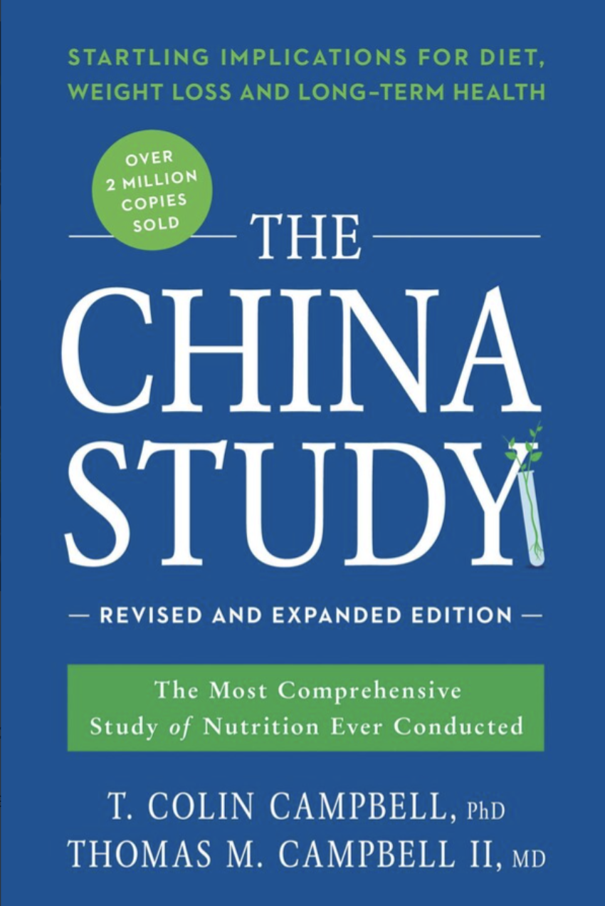 Cover of the book titled "The China Study" with a blue background, featuring a green circle that states "Over 2 Million Copies Sold," and an image of a test tube with green leaves at the bottom