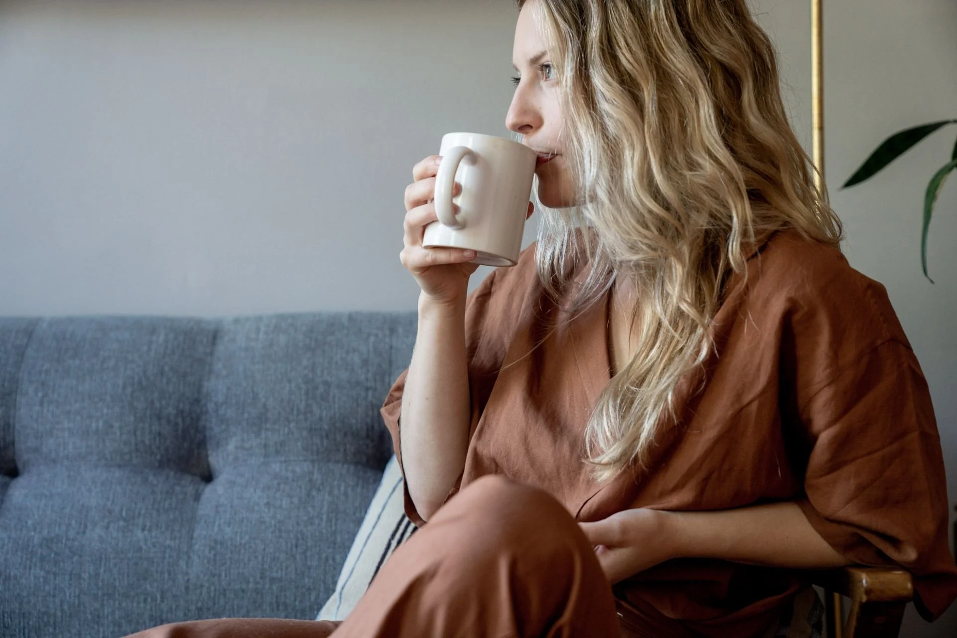 Woman at home reflecting on her identity beyond career