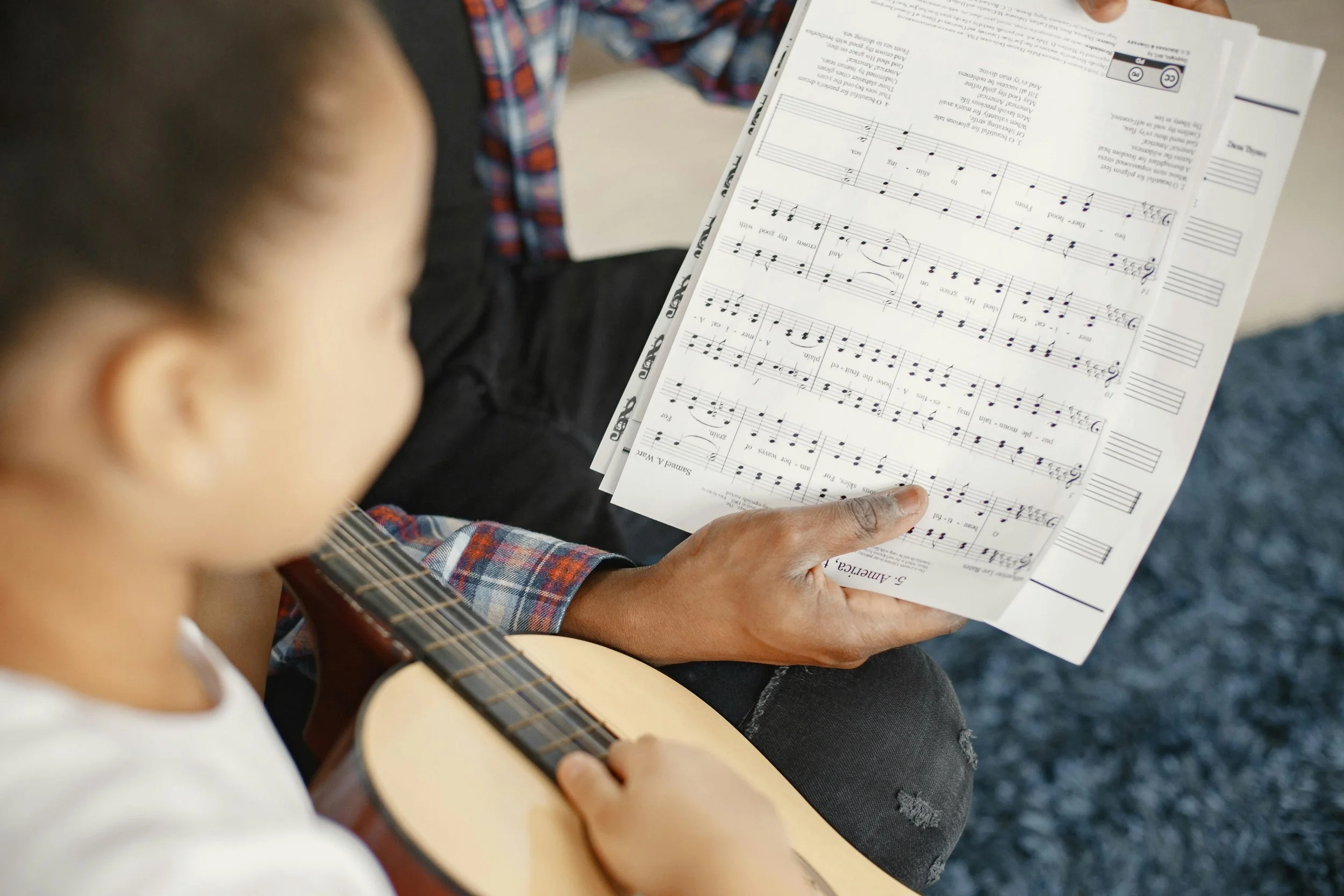 Image of a student learning sheet music during music lessons