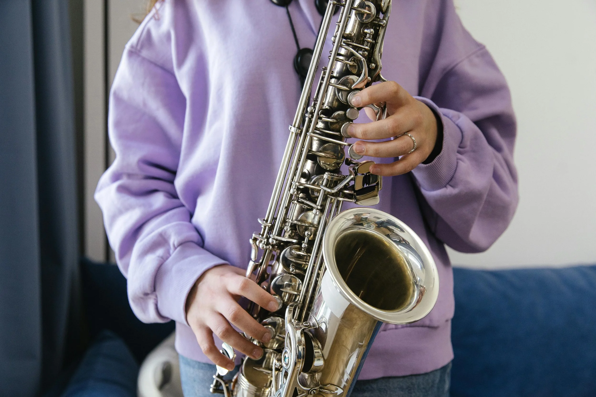Image of a child playing the saxophone