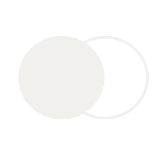 A white soccer ball with a black patch design on a black background.