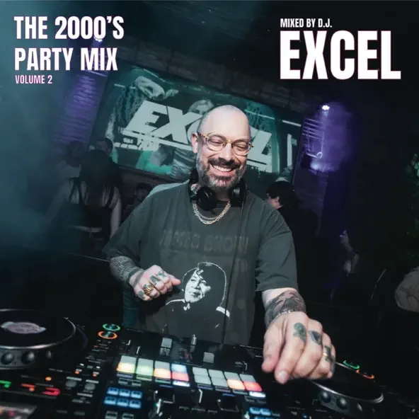 DJ smiling at turntables in a nightclub with a large screen in the background displaying the text 'The 2000's Party Mix Volume 2' and 'Mixed by D.J. Excel'.