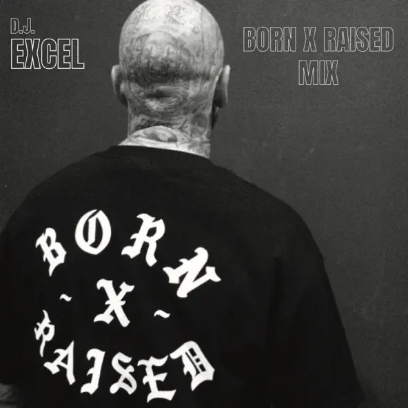 Back of a person with a bald head, wearing a black t-shirt with 'BORN RAISED' written in bold white letters in a circular pattern on the back, and additional text in the top right and left corners mentioning DJ Excel and the Born X Raised mix.