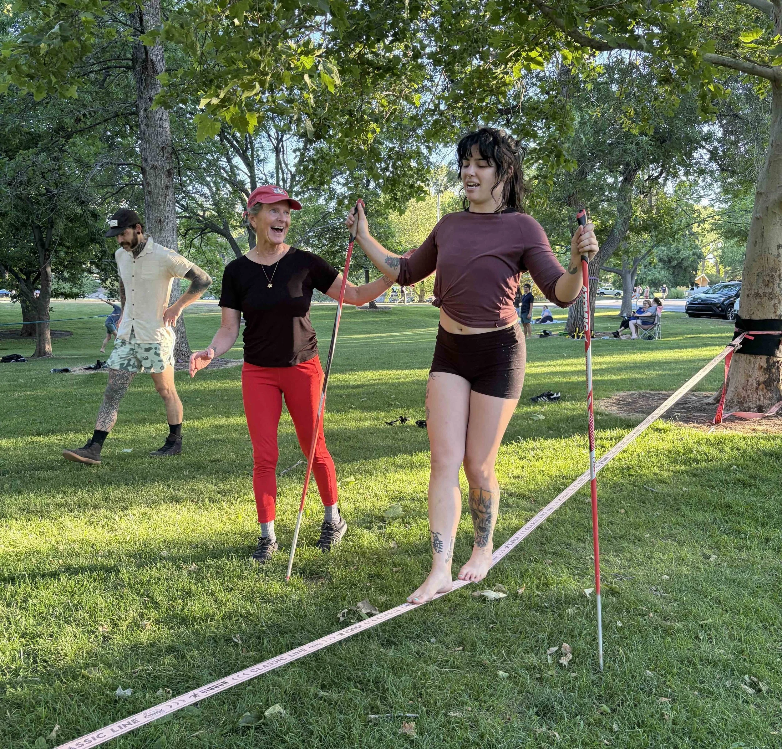 Rae Raptor teaching slacklining in the park