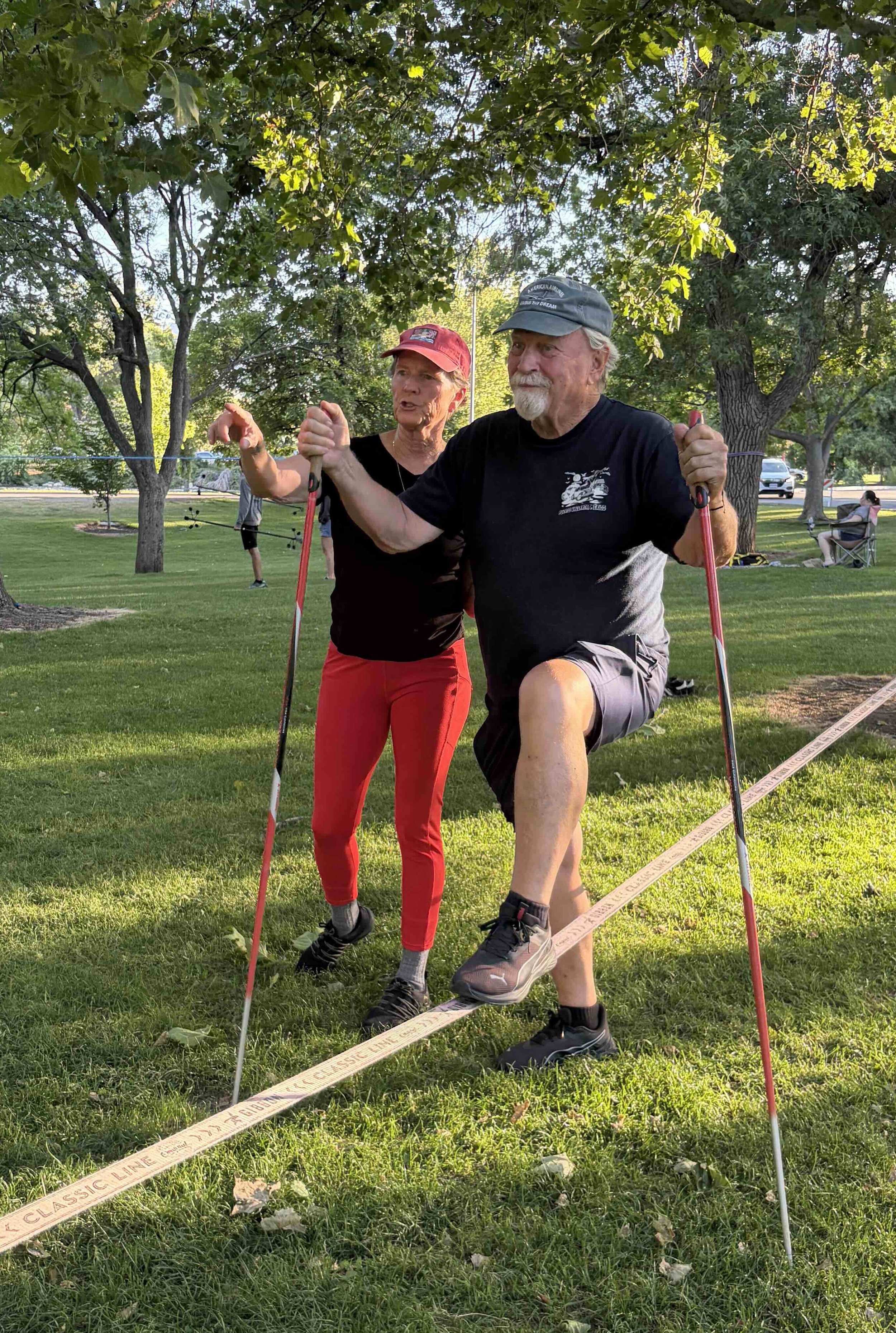 Rae Raptor teaching slacklining in the park
