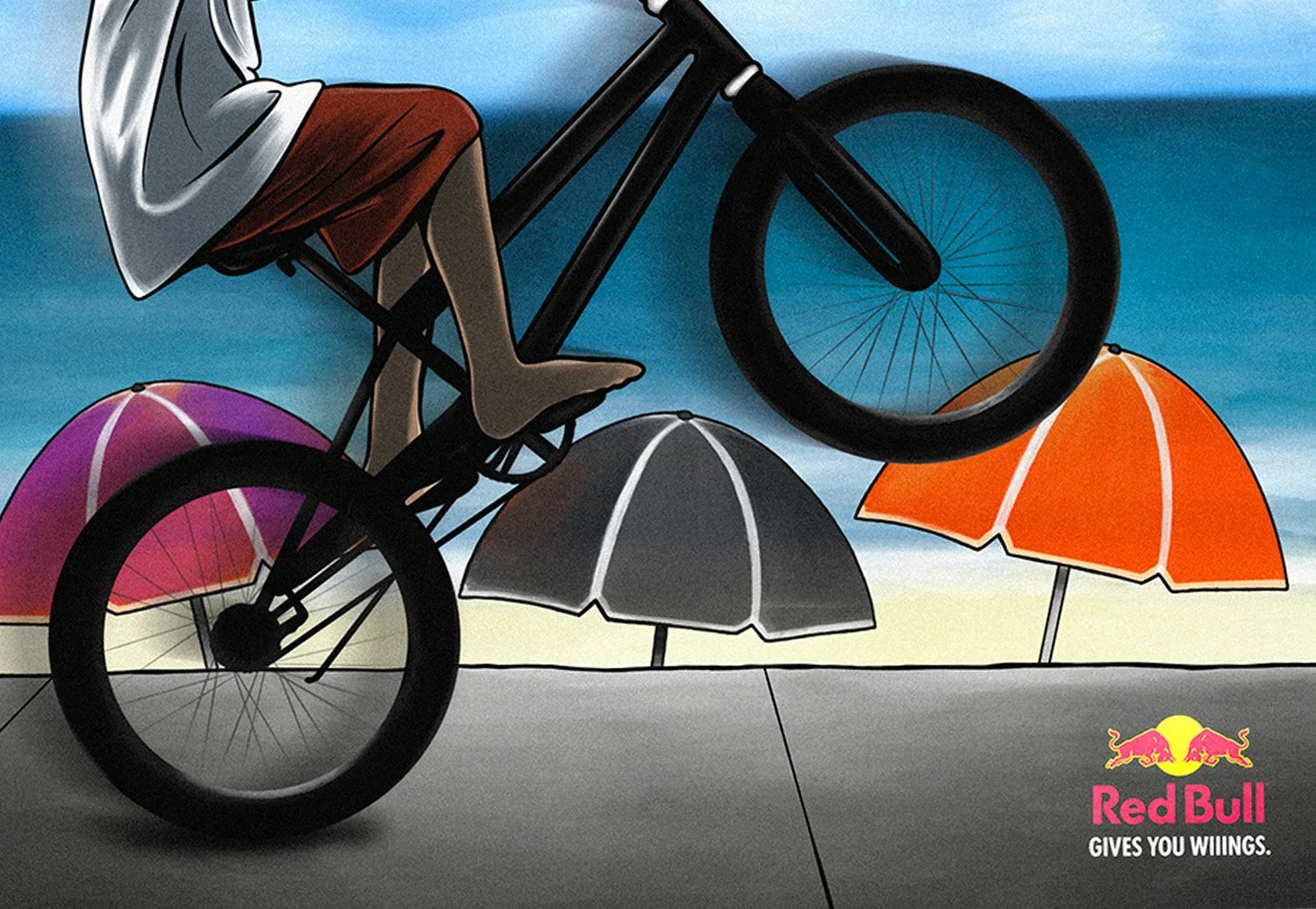 A person riding a bicycle on a beach with colorful umbrellas in the background, and the Red Bull logo with the slogan 'Gives You Wings' in the bottom right corner.