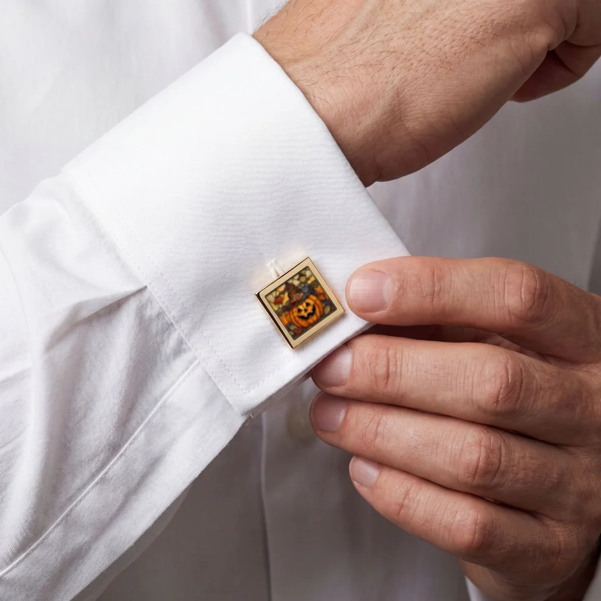 cute mans cuff link with a stain glass motif with a pumpkin and black cat . cute for fall and halloween