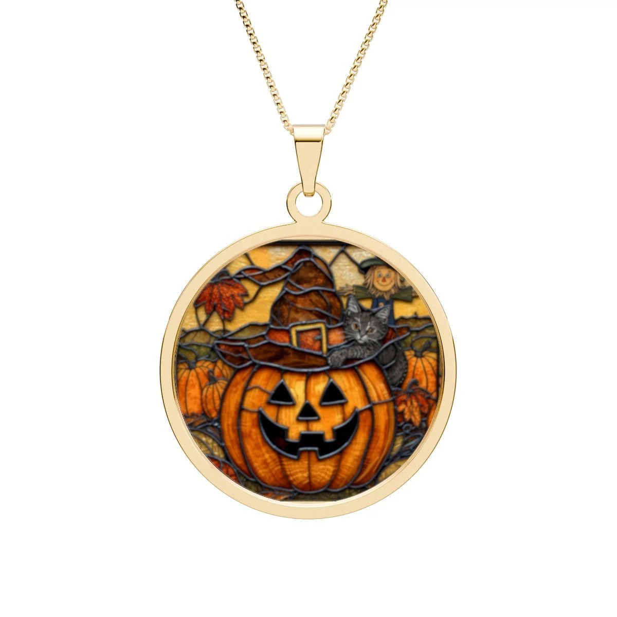 round pendant with chain. with a stained glass pumpkin in the middle with a witch hat on a black cat smiling