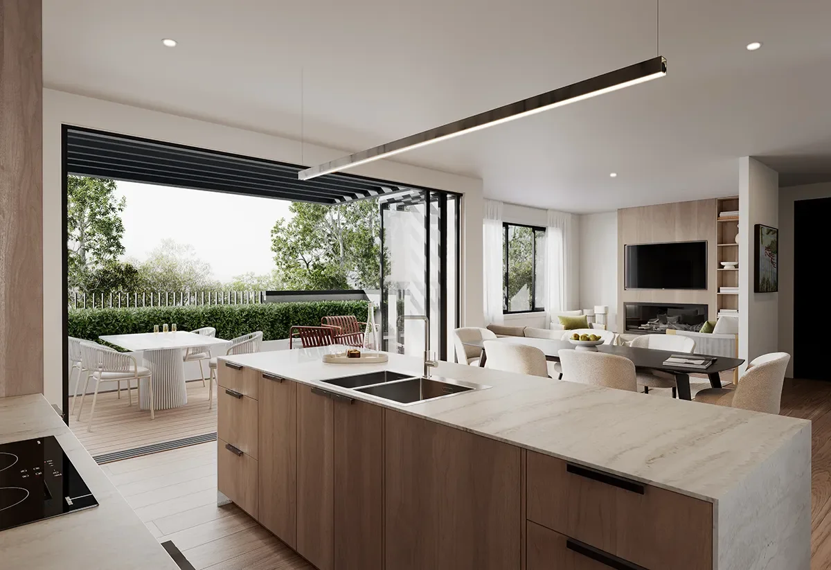 A modern open-concept kitchen and living room with a view of an outdoor patio and greenery.
