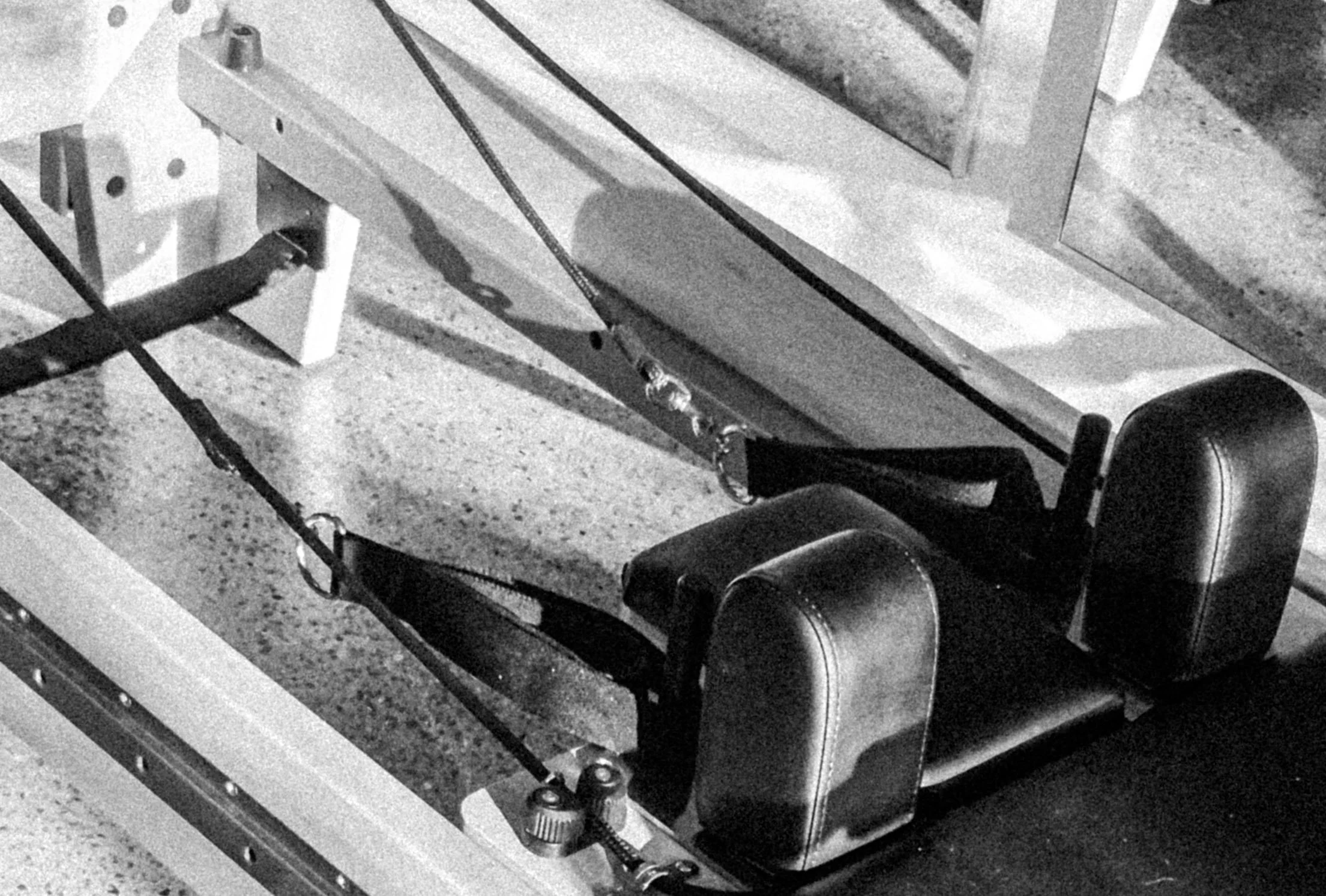 Black and white photo of a pilates reformer.
