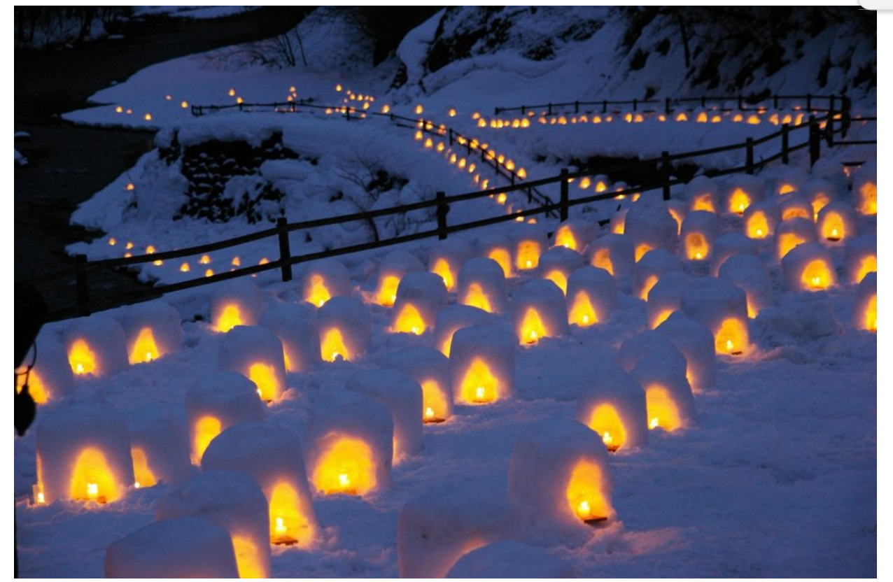 Lantern festival in Yunishigawa, Japan showing small lantern domes across the town's pathways at dusk