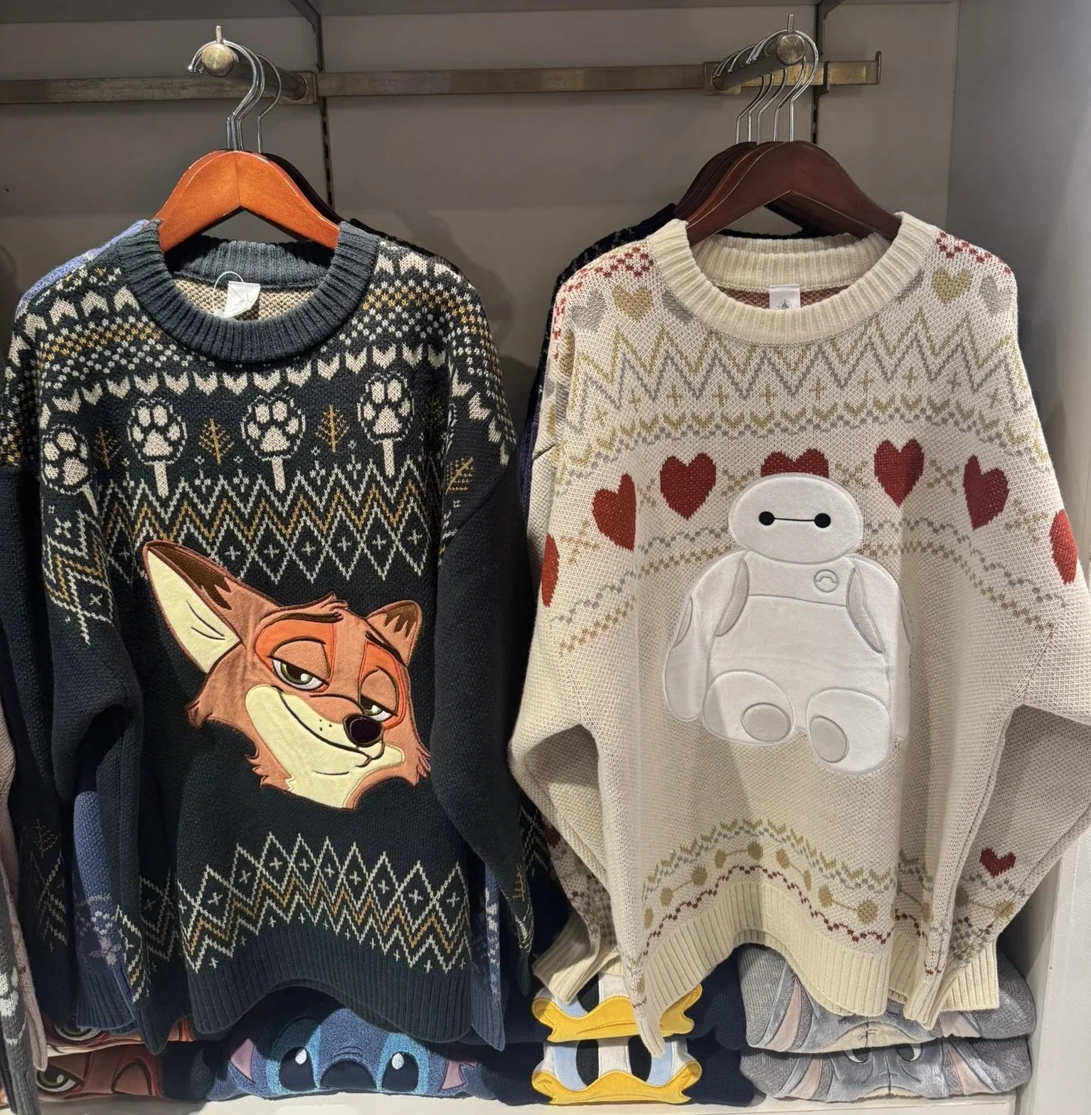 Disney Christmas sweaters with Zootopia and Baymax on them.