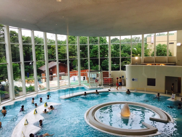 Public bathing facility artfully designed with circles and organic shapes.
