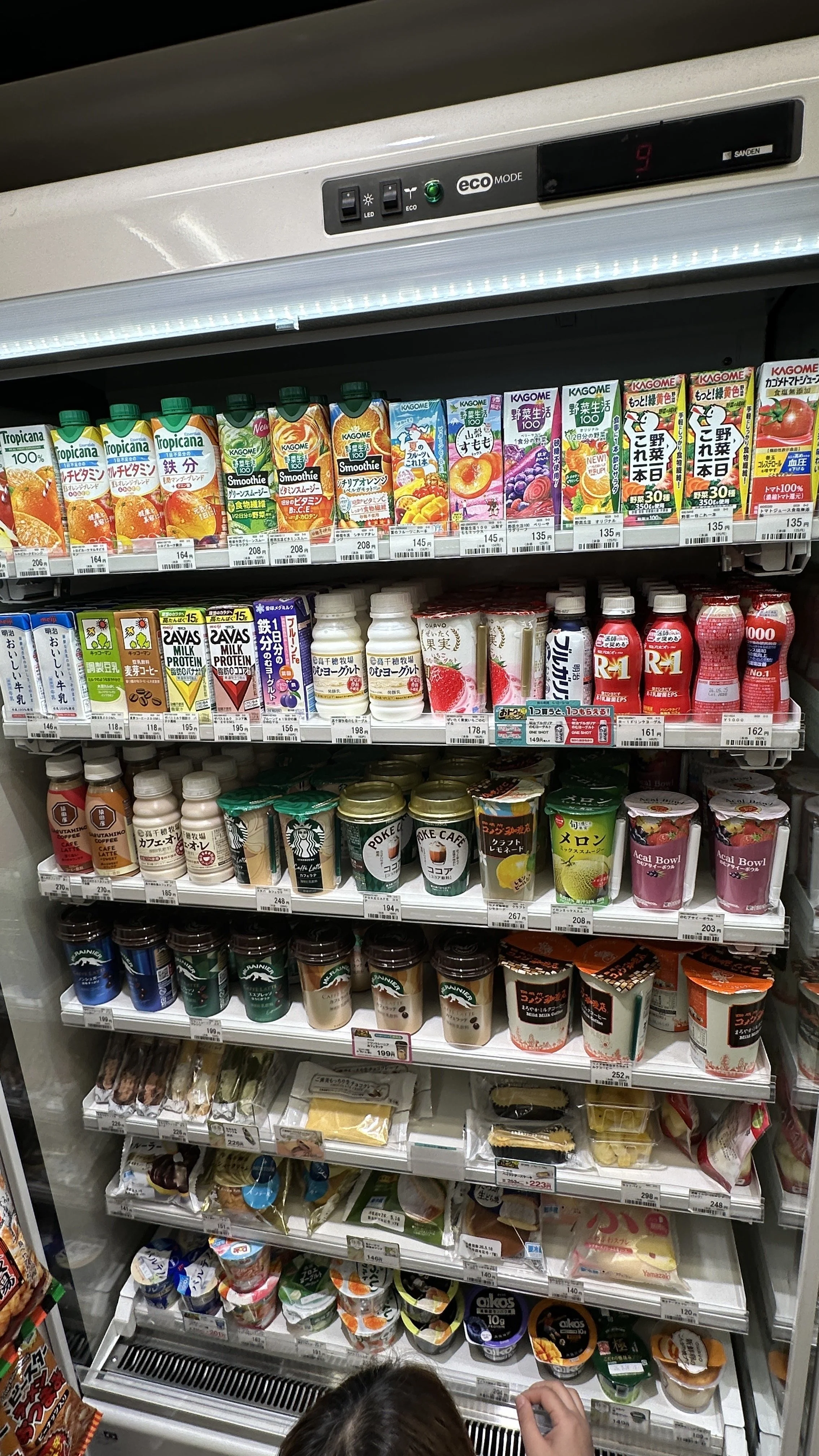 Cold items including drinks, yogurts, and fruits.