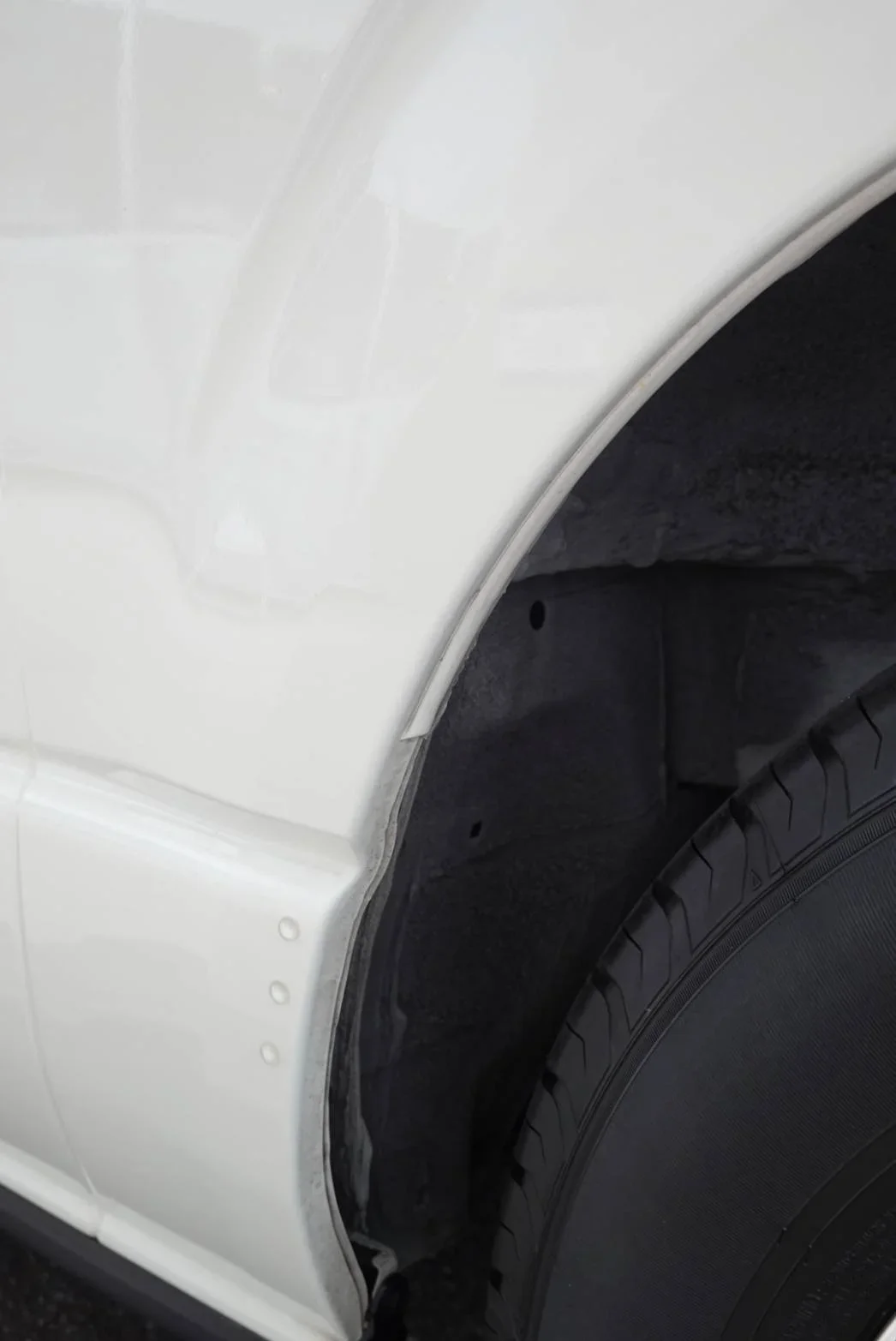 Up close image of the wheel of a TokidAw Japan Private Driver Fleet vehicle.