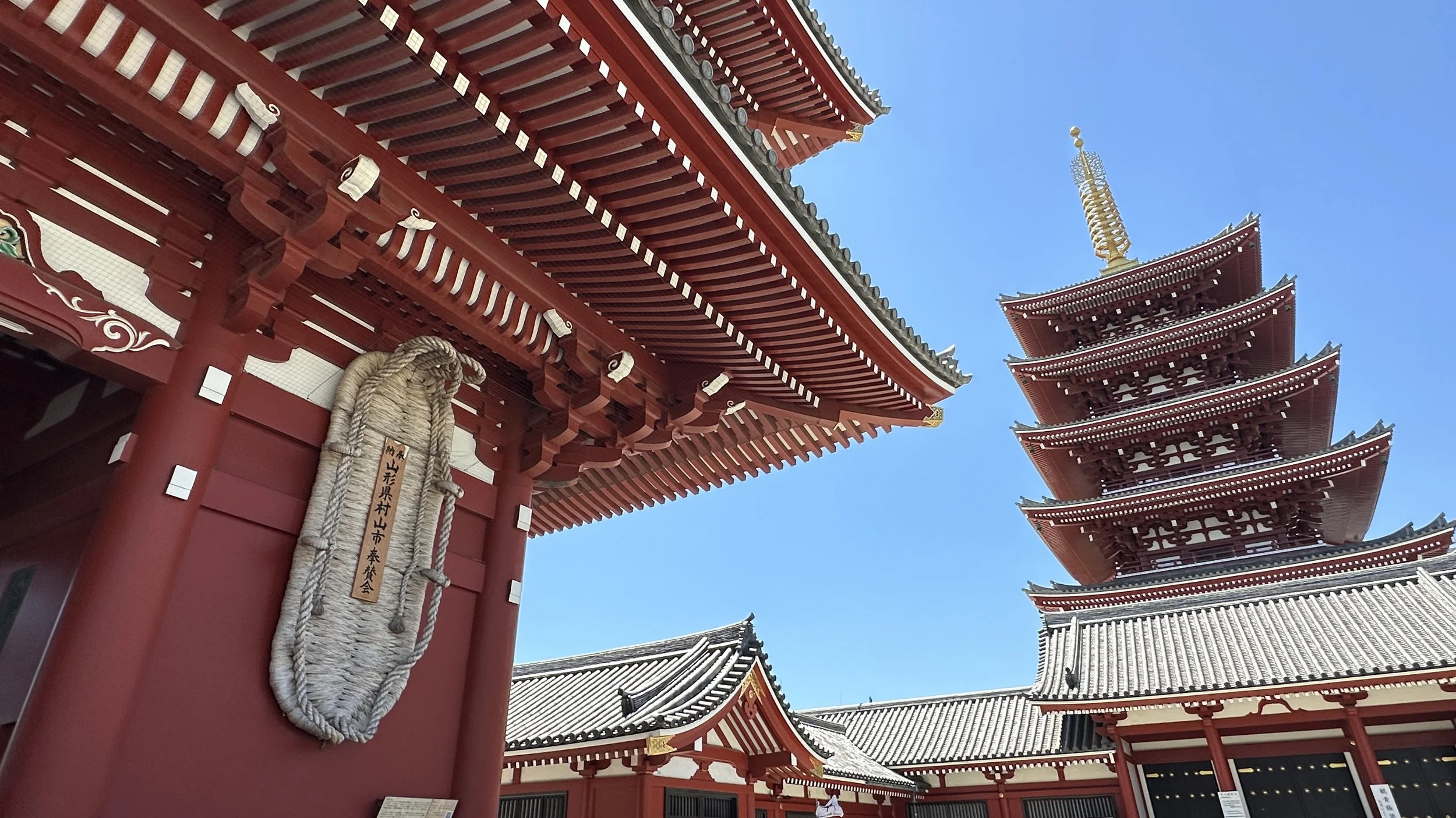 Sensoji tori gate and pagoda from the back and shot from below.