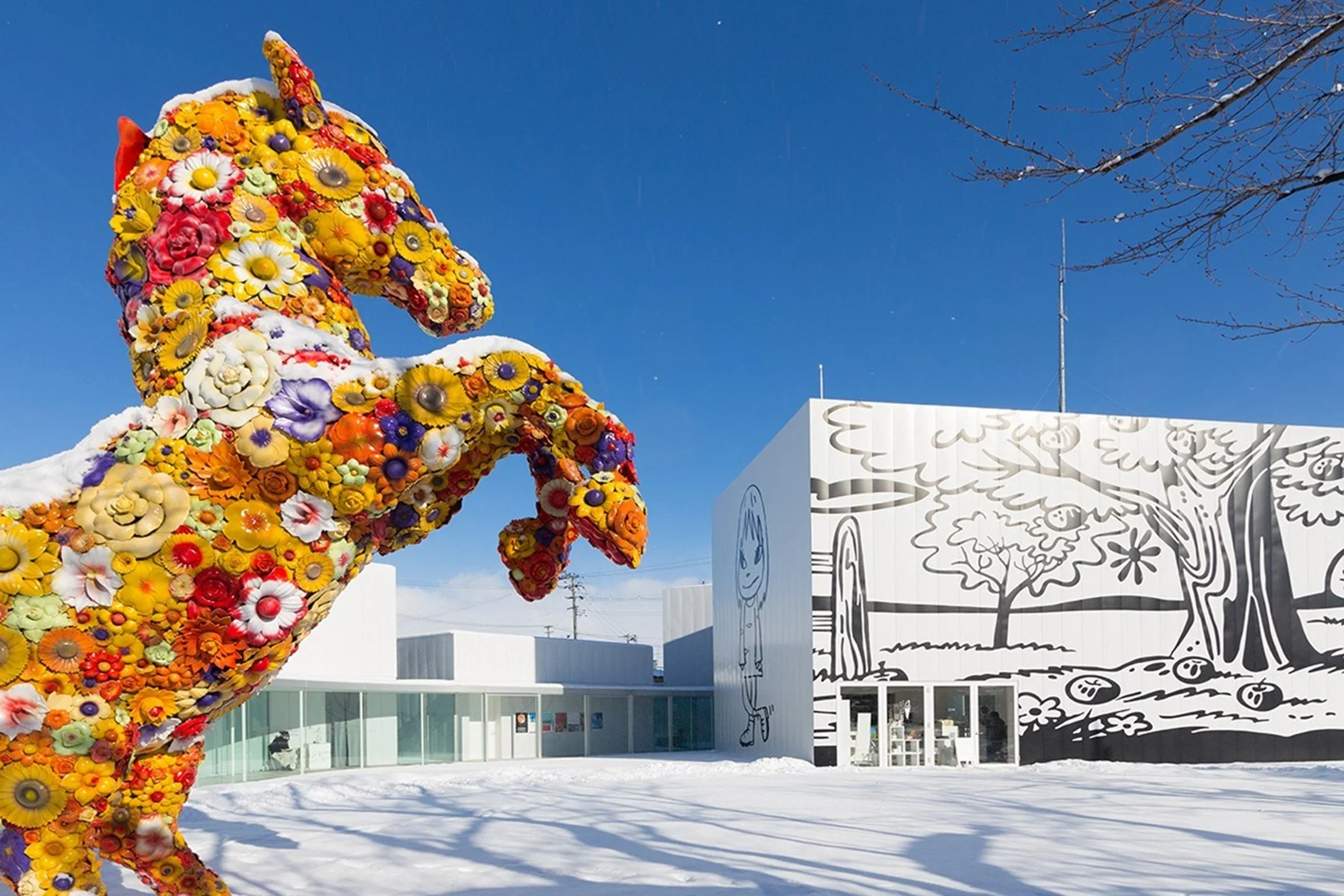 Towada Art Cente with a horse statue made out of flowers.