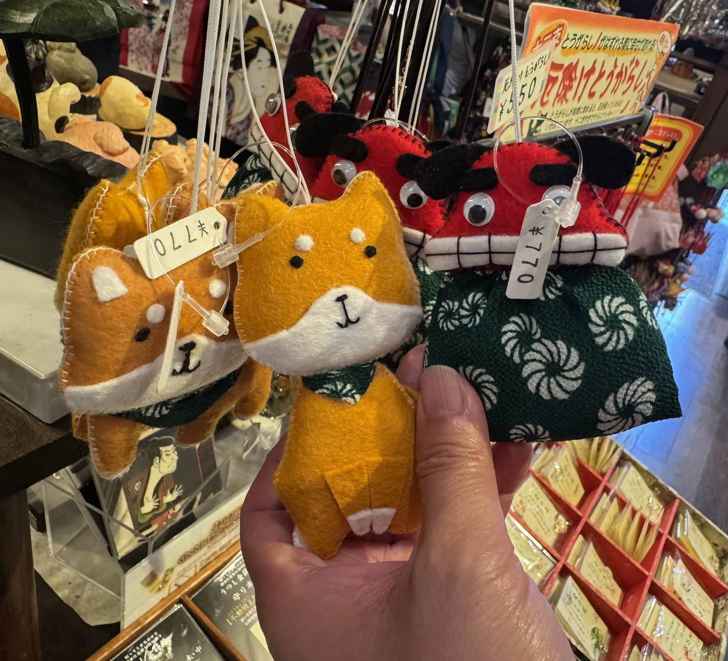 A dog and dragon felt toy perfect for hanging on the Christmas tree.