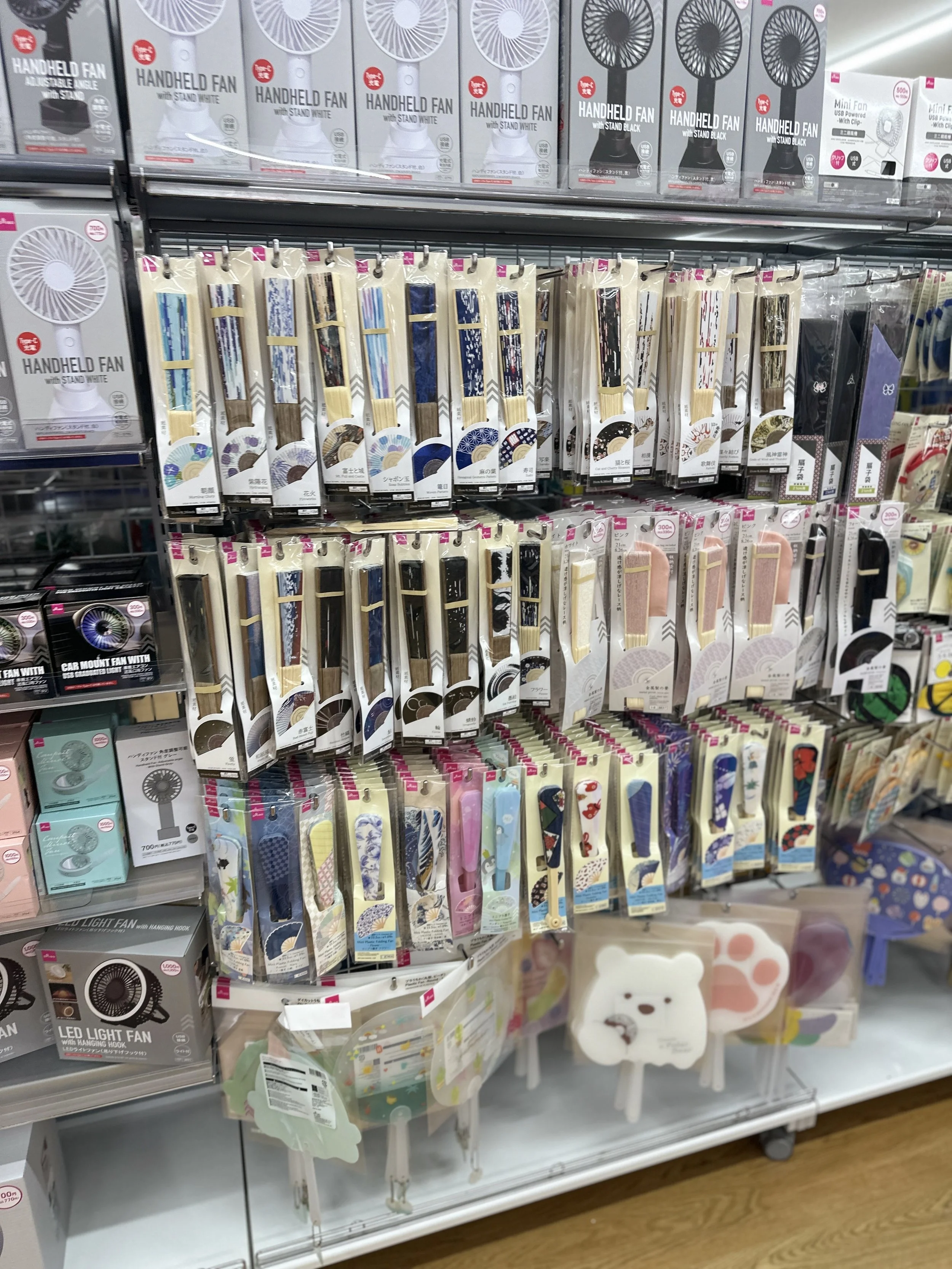 Seasonal products like Japanese fans at Daiso in the mall Ispiriaki near Tokyo Disney Resort.