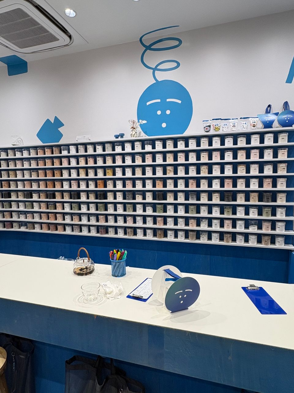 Different types of salt in jars are lined up in a row in a store located in Sky Tree in Tokyo, Japan.