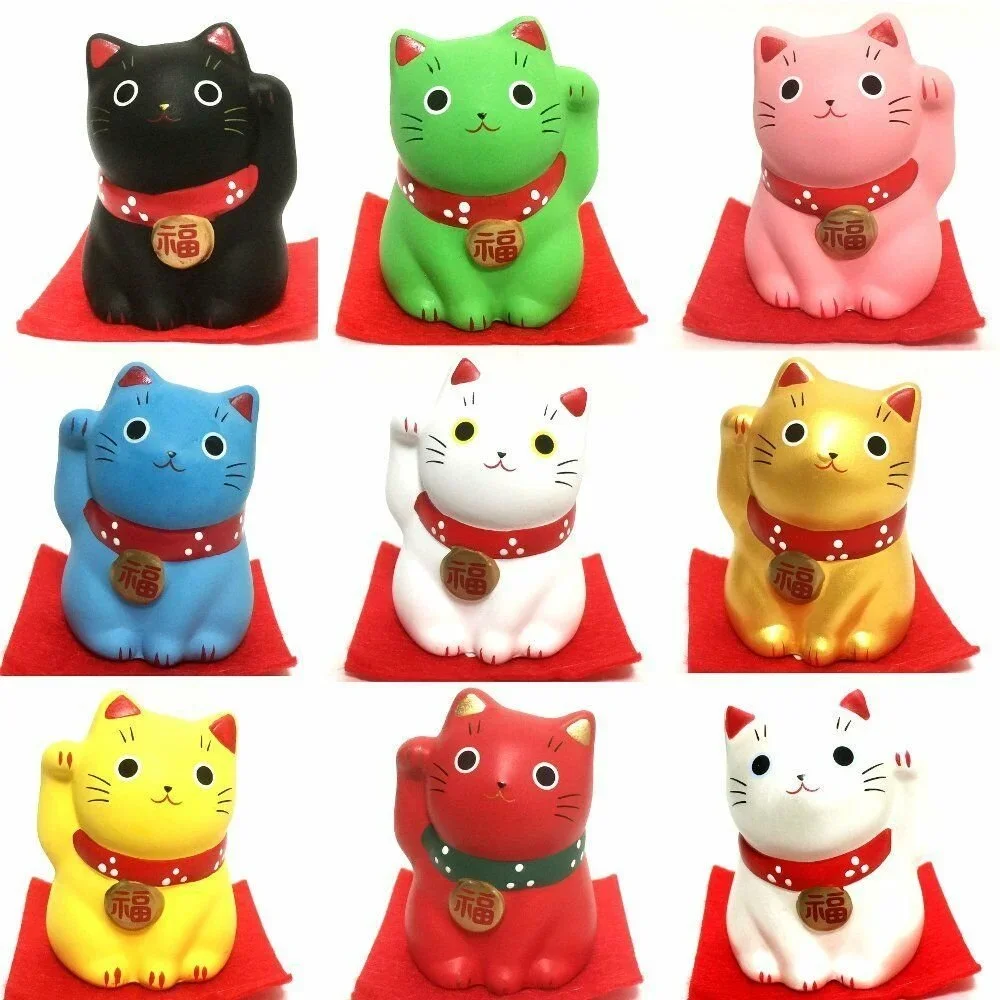 Colorful figurines of Japanese welcoming cats