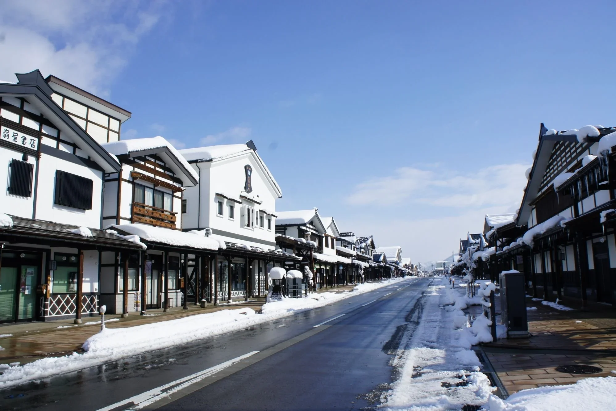 Image of a traditional Japanese post town with warehouse and wooden strucutres.