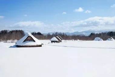 A traditional Japanese village in a winter scape on a blue ski Japanese day.