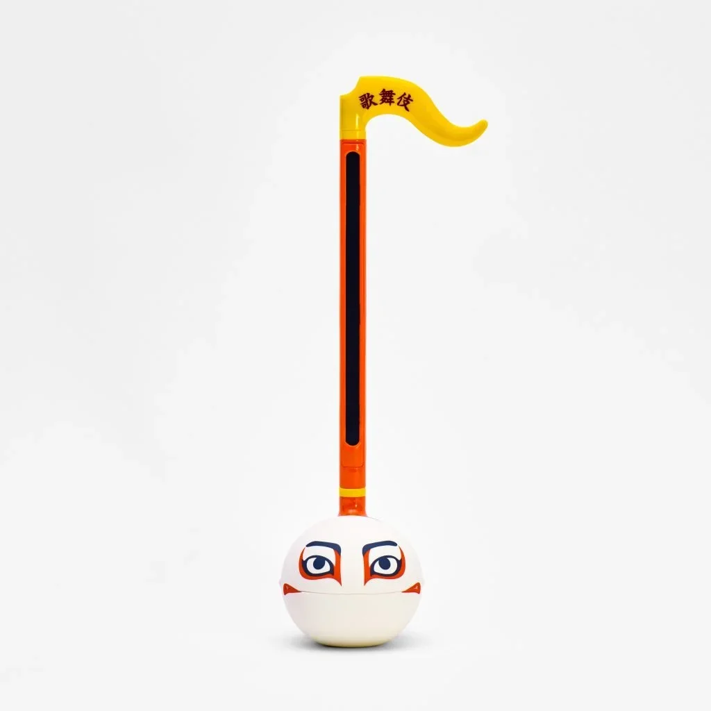 A music shaped instrument with a face painted on the bulb.