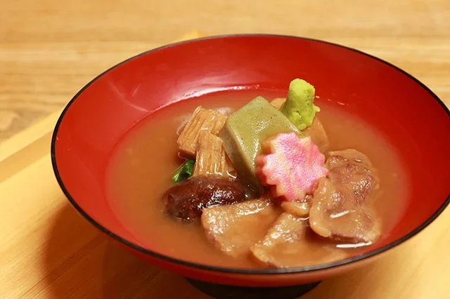 A colorful soup with vegetables, and beef from Kanazawa.