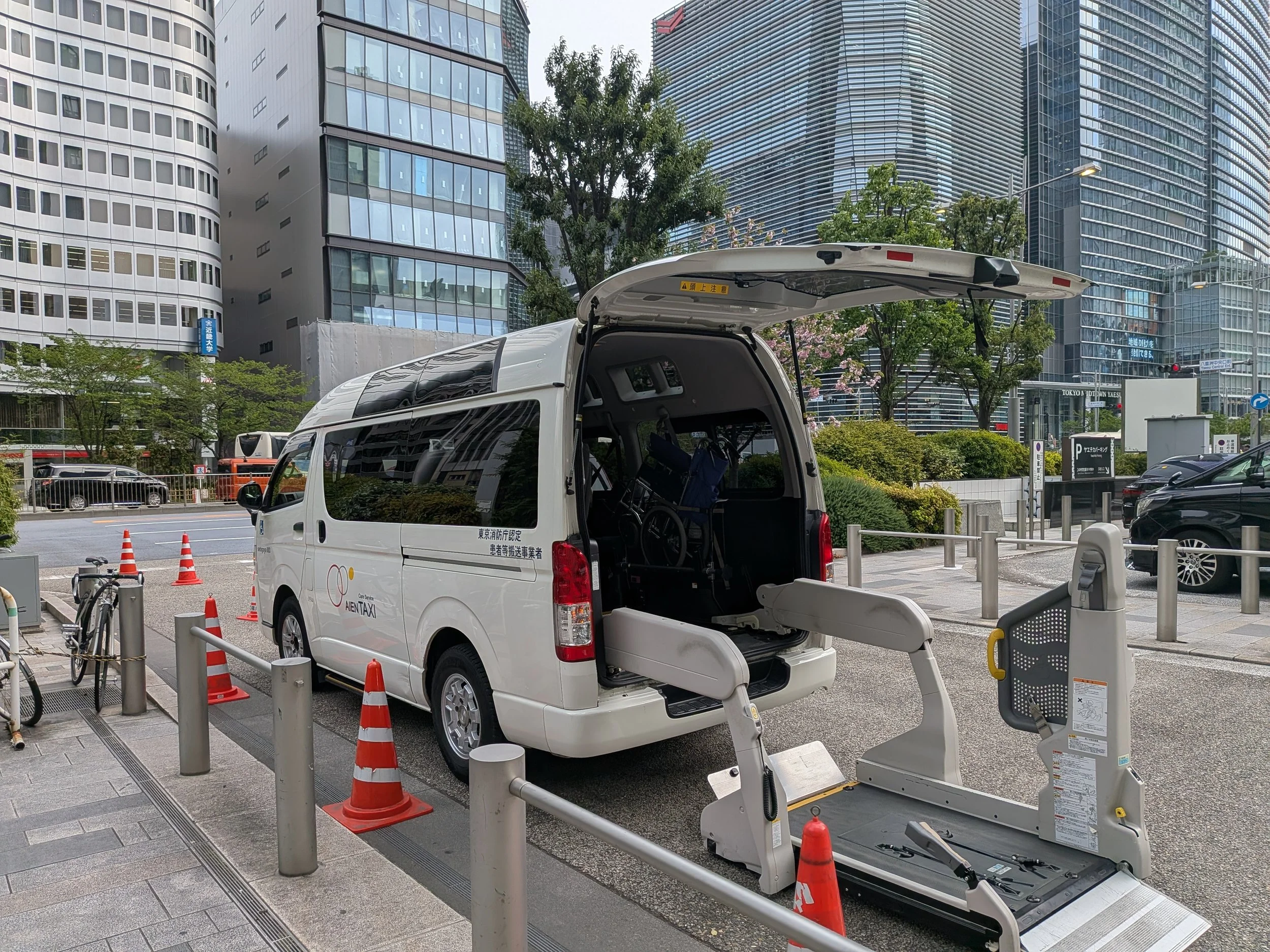 White Van with wheelchair lift parked on a road in a Tokyo