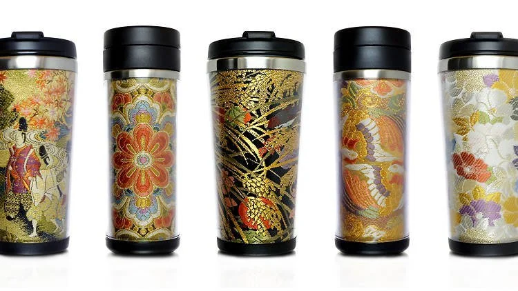 Tumbler mugs with a patterned obi or kimono fabric embedded in the tumbler.