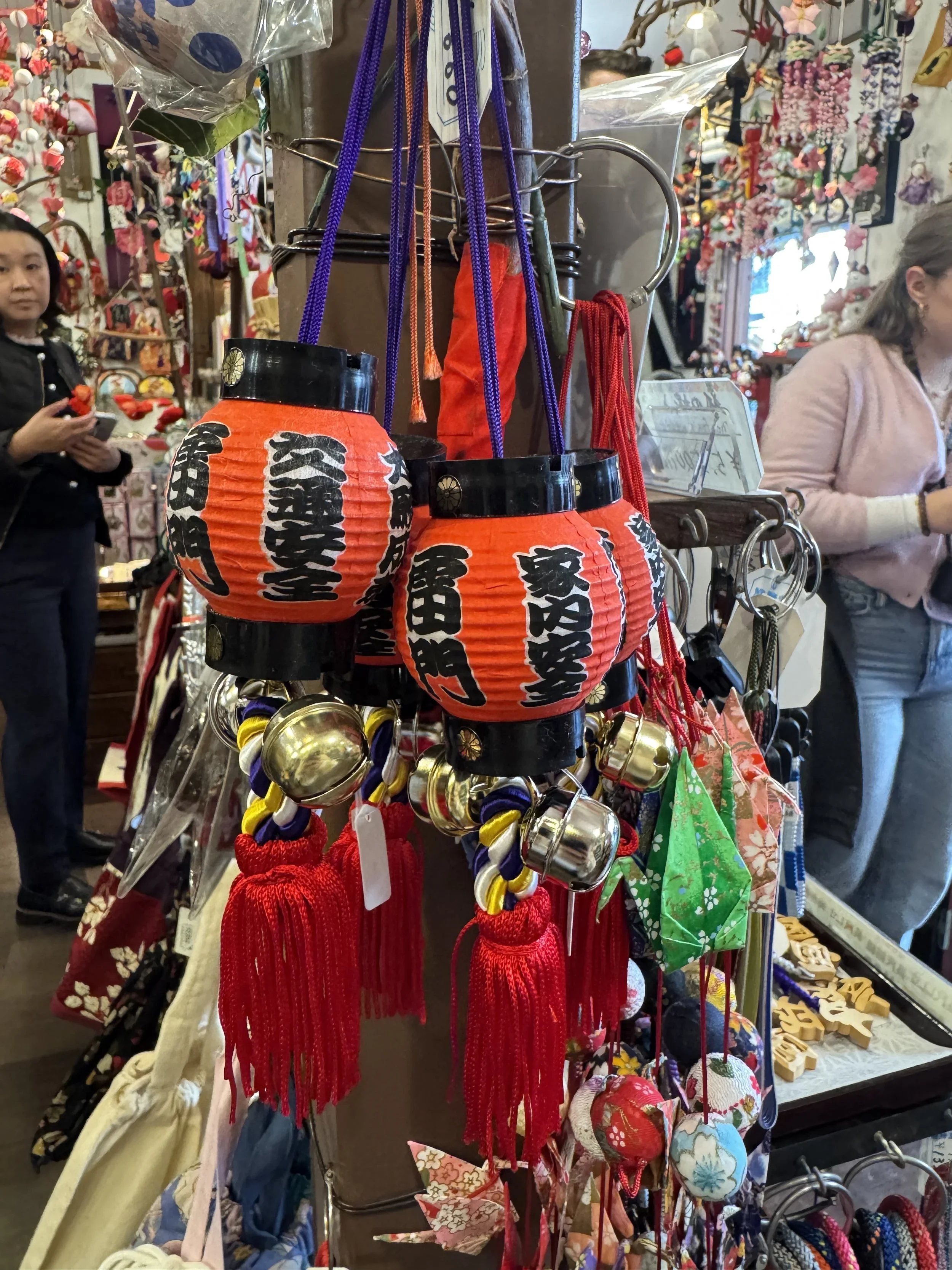 A paper red lantern hangs from a string.