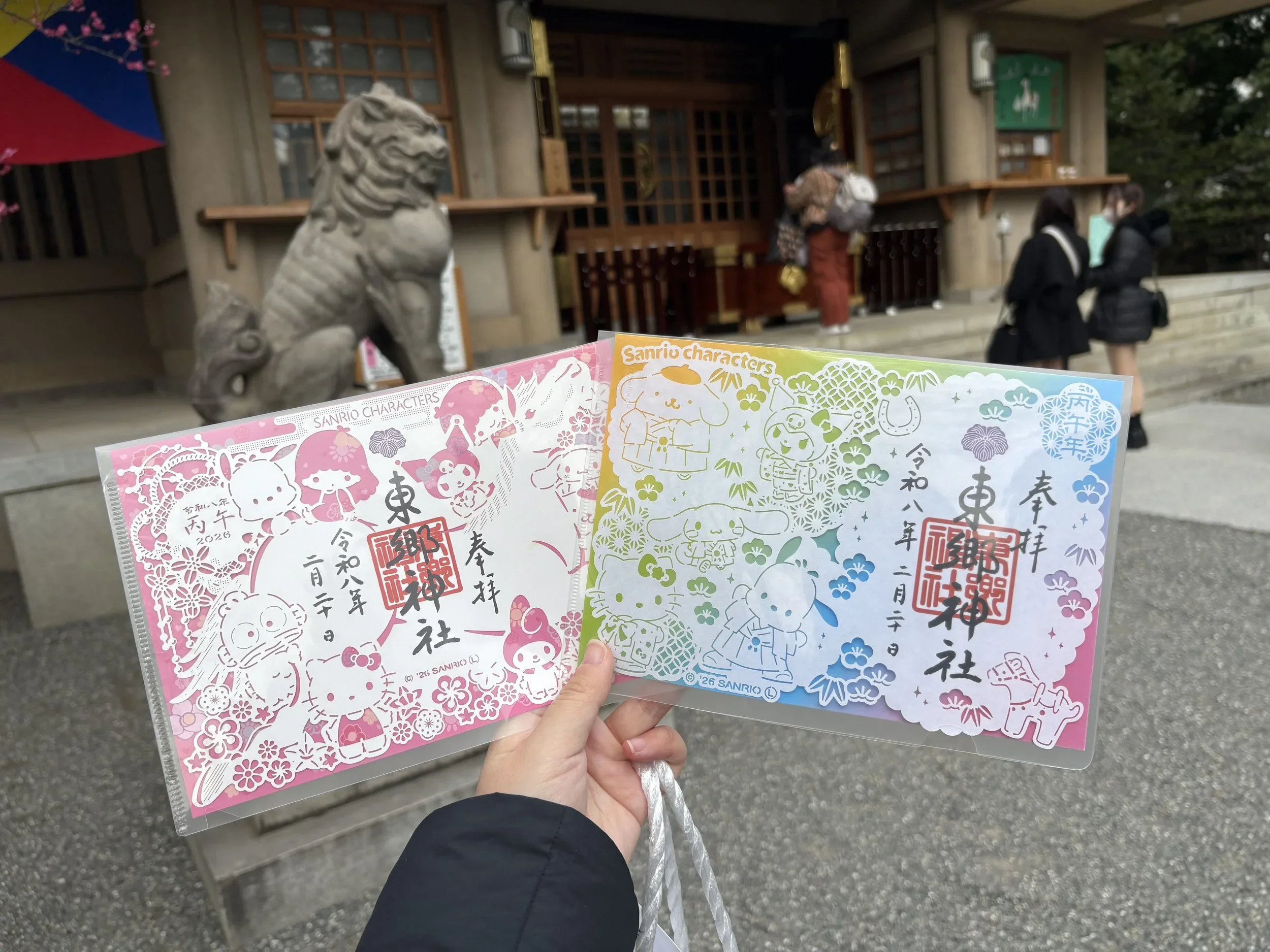 A colorful laser cut paper Sanrio goshuin or calligraphy stamped seal that can be purchased at the shrine