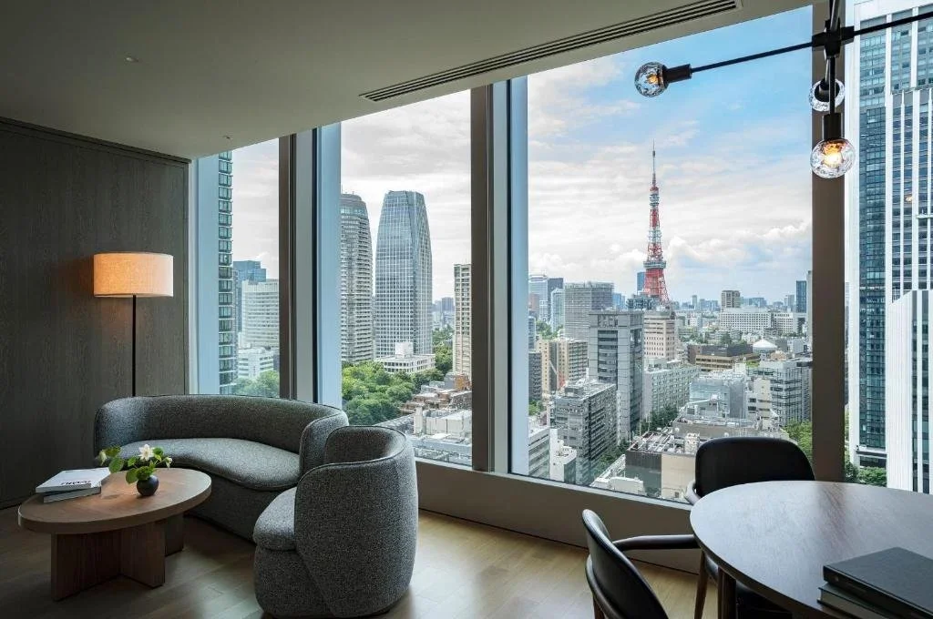View of Tokyo Tower through a lounge inside Hotel Toranomon Hills in Tokyo, Japan.