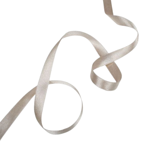 Close-up of a white satin ribbon curled on a white surface.