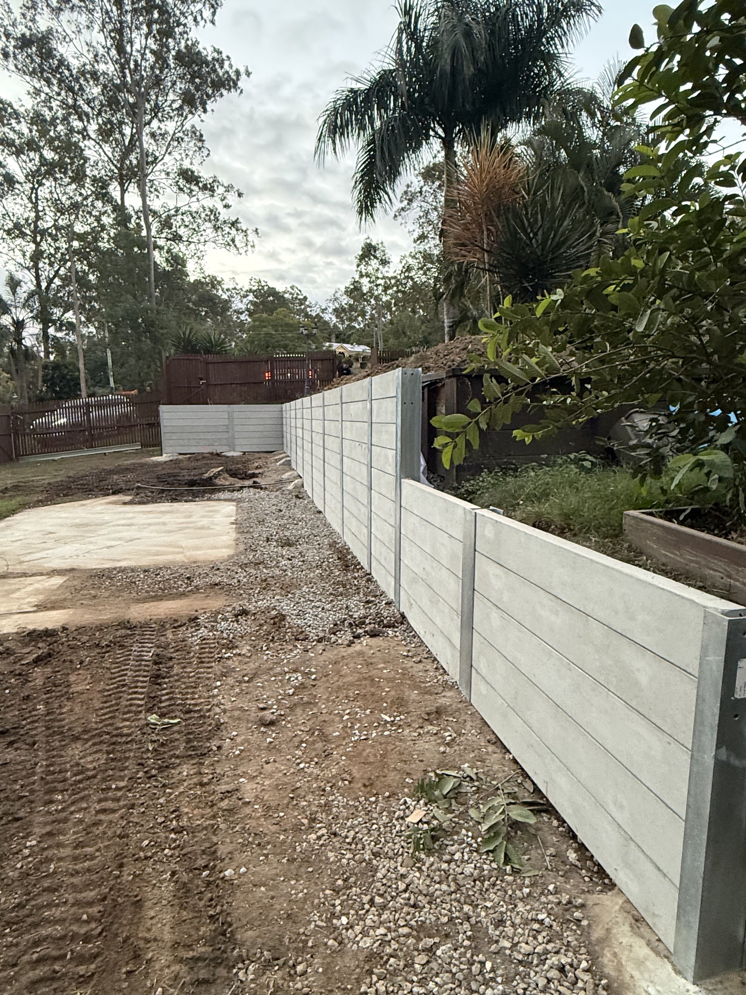 heavy duty steel post and concrete sleeper retaining wall built from engineering plans