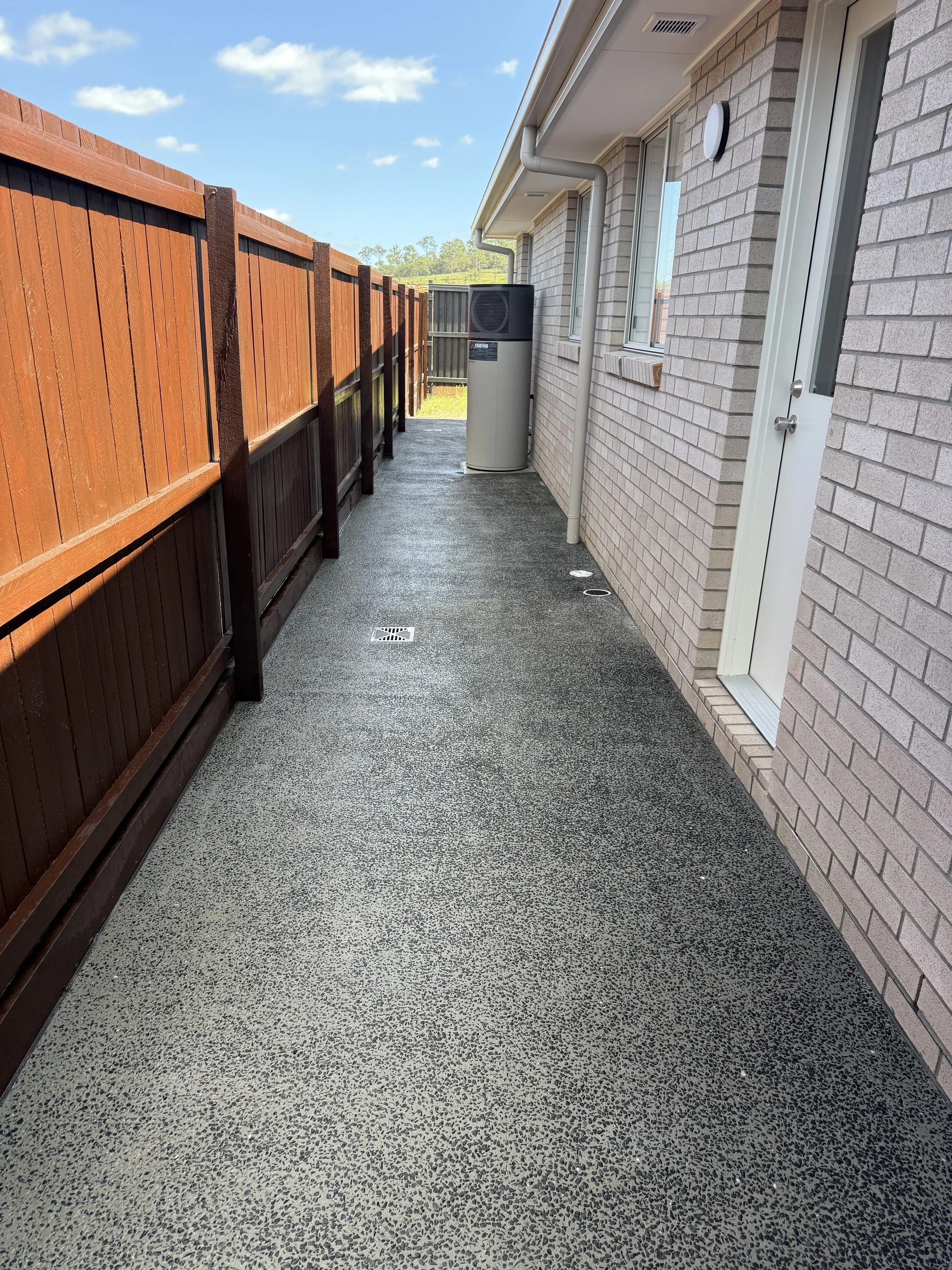 exposed aggregate concrete house surround foothpath