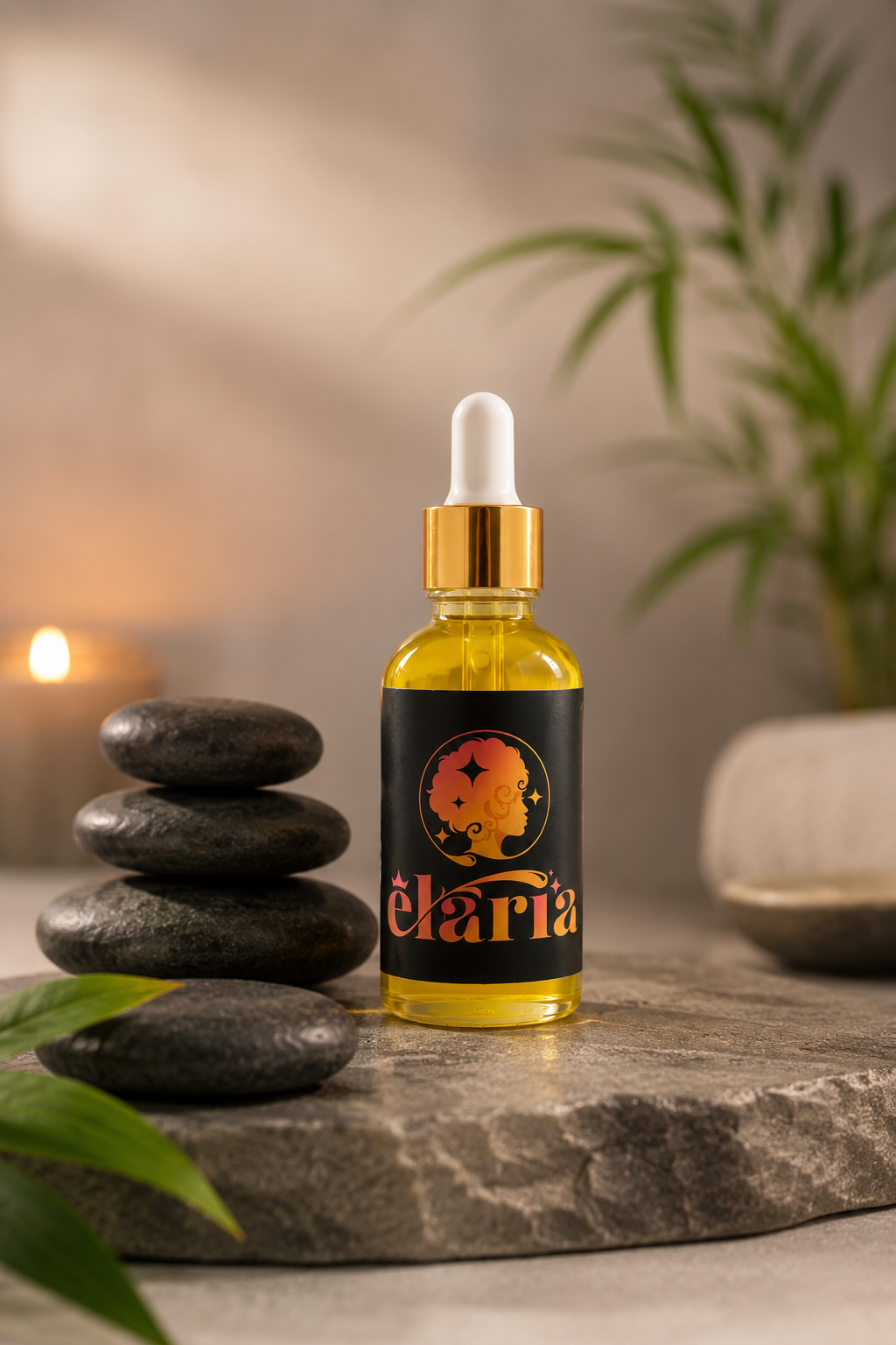 A small yellow bottle with a white dropper cap, labeled 'Élarria,' is placed on a stone slab. To its left, there is a stack of four black, smooth, water-worn stones. In the background, there are green plants and a softly lit candle.