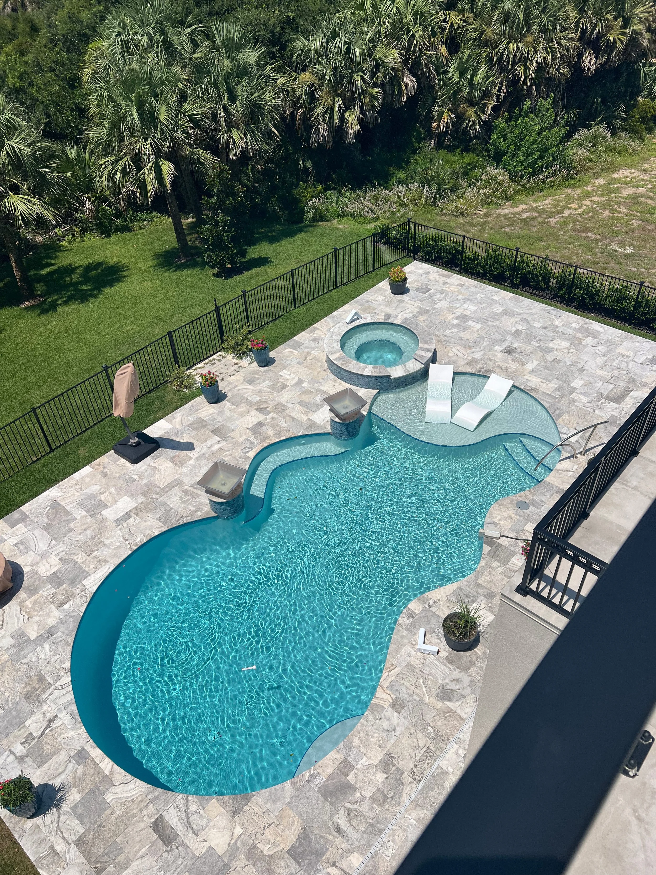 Step into your own Palm Coast paradise, where a sparkling resort-style pool, bubbling spa, and tropical palms create the perfect setting for slow mornings, sunny afternoons, and relaxing evenings outdoors.