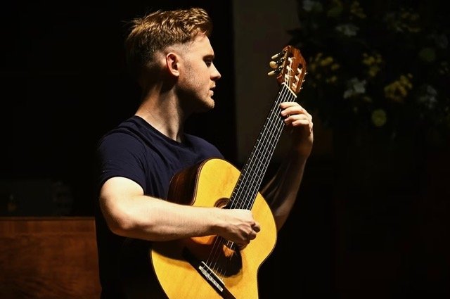 Jack Hancher with guitar