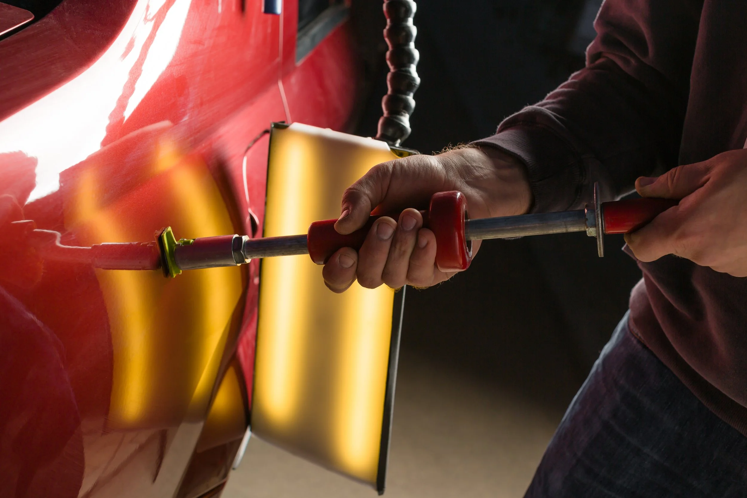 repairing-car-dent-after-accident-by-paintless-dent-repair.jpg.jpeg